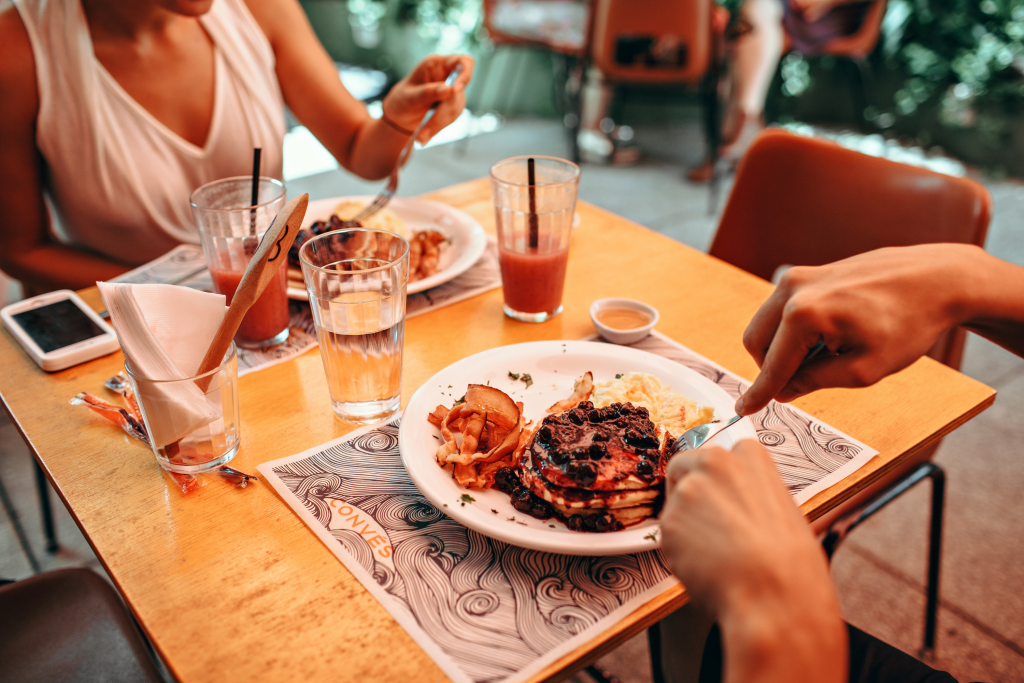 two people eating out at a restaurant